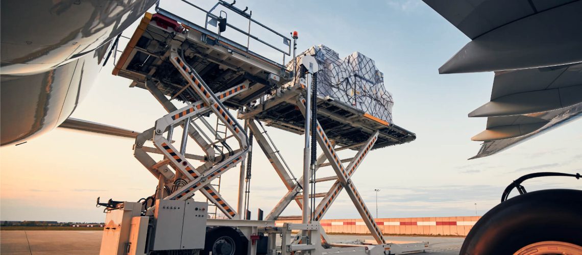 loading-of-cargo-containers-to-airplane-at-sunset.jpg